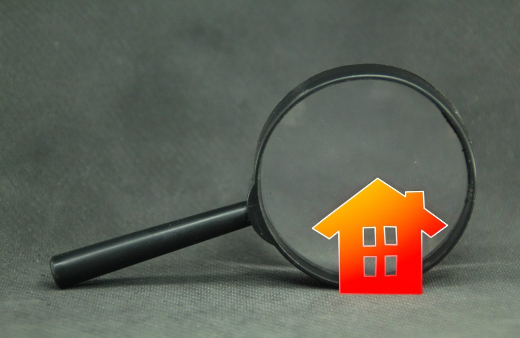 magnifying glass and house. Property inspection or home search concept